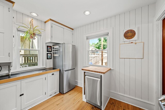 3841 Columbus Ave, Minneapolis, MN 55407 - kitchen featuring freestanding refrigerator, white cabinetry, light wood-type flooring, and recessed lighting