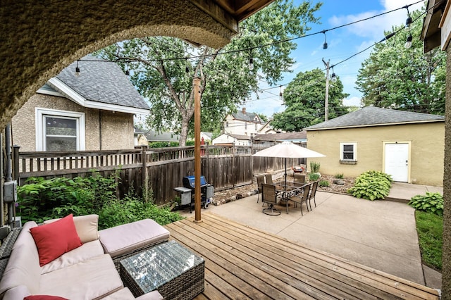 3841 Columbus Ave, Minneapolis, MN 55407 - wooden terrace with area for grilling, an outdoor hangout area, outdoor dining area, and a patio area