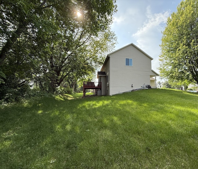 2052 Wilhelm Ct, Shakopee, MN 55379 - view of home's exterior featuring a lawn and a wooden deck