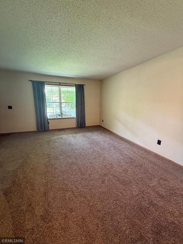 2052 Wilhelm Ct, Shakopee, MN 55379 - empty room featuring carpet floors and a textured ceiling