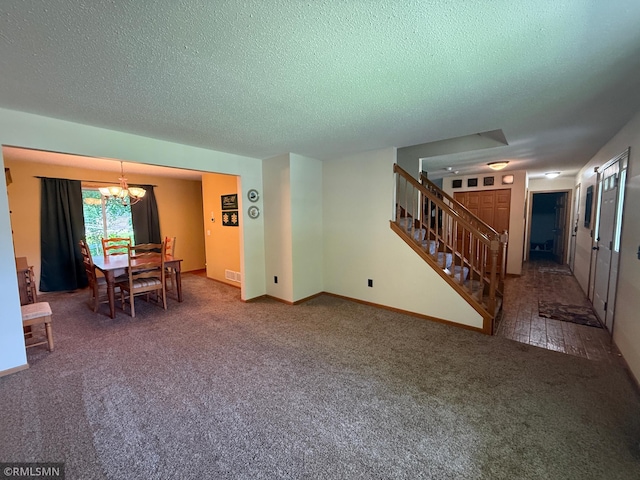 2052 Wilhelm Ct, Shakopee, MN 55379 - dining area with a chandelier, stairs, carpet floors, and a textured ceiling