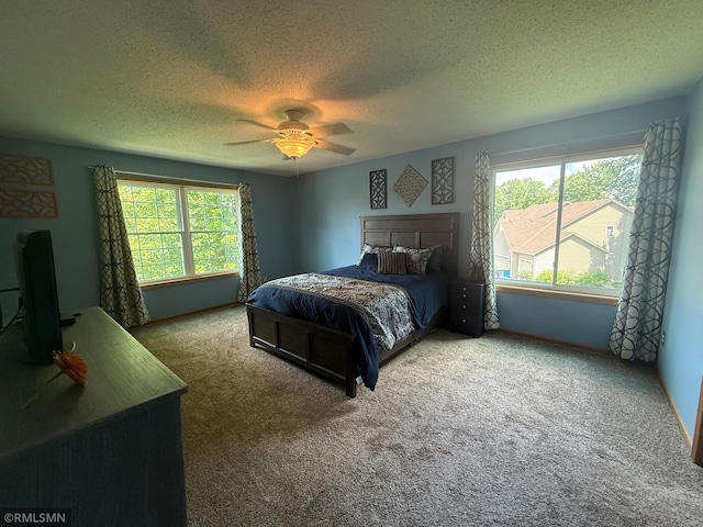 2052 Wilhelm Ct, Shakopee, MN 55379 - carpeted bedroom featuring a textured ceiling and ceiling fan