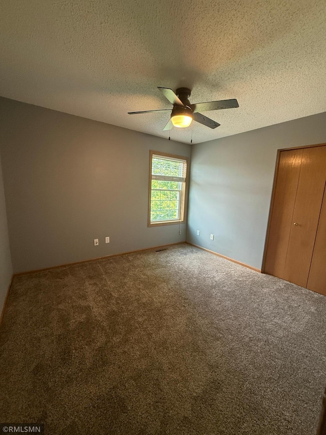 2052 Wilhelm Ct, Shakopee, MN 55379 - carpeted empty room featuring ceiling fan and a textured ceiling