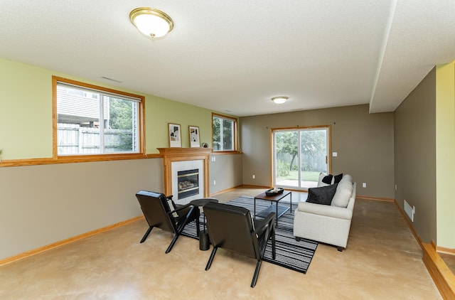 4626 Savannah Dr NW, Rochester, MN 55901 - living area featuring a fireplace and a textured ceiling