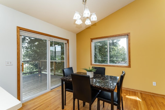 4626 Savannah Dr NW, Rochester, MN 55901 - dining space with a chandelier, vaulted ceiling, and light wood-style flooring
