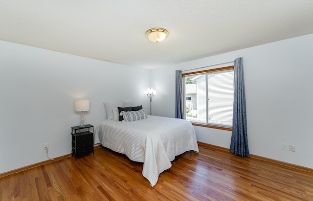 4626 Savannah Dr NW, Rochester, MN 55901 - bedroom with wood finished floors and baseboards
