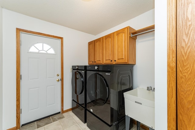 4626 Savannah Dr NW, Rochester, MN 55901 - laundry room with cabinet space, washing machine and clothes dryer, light tile patterned floors, and a textured ceiling