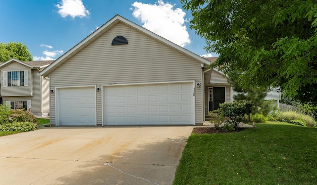 4626 Savannah Dr NW, Rochester, MN 55901 - view of front of home with a front lawn, concrete driveway, and an attached garage