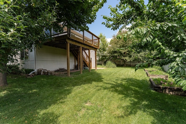 4626 Savannah Dr NW, Rochester, MN 55901 - view of yard featuring a deck, stairs, and a vegetable garden