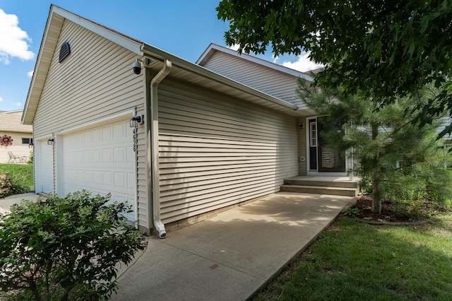4626 Savannah Dr NW, Rochester, MN 55901 - view of property exterior with a garage and concrete driveway
