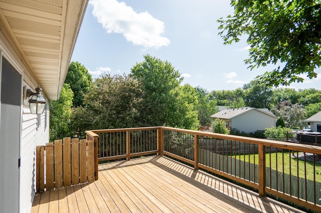 4626 Savannah Dr NW, Rochester, MN 55901 - deck featuring a yard and view of wooded area