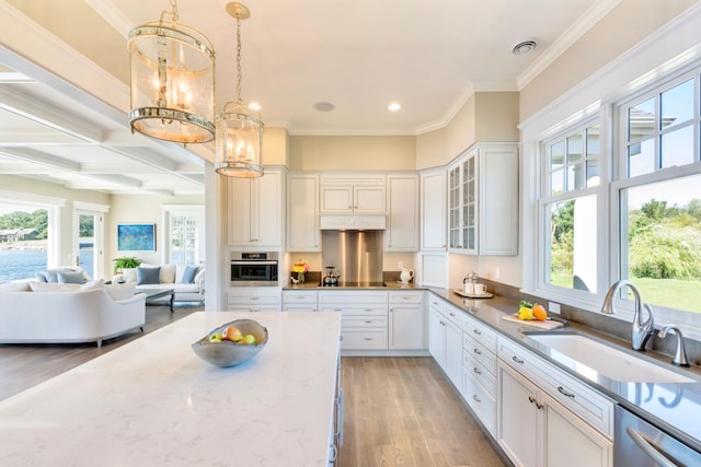 1105 Ferndale Rd W, Orono, MN 55391 - kitchen with stainless steel appliances, light wood-type flooring, white cabinetry, ornamental molding, and recessed lighting