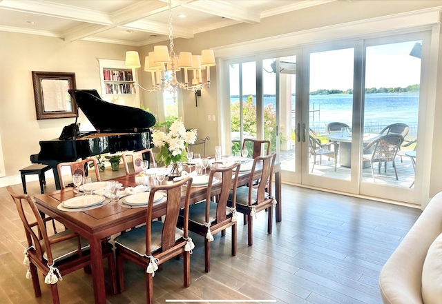 1105 Ferndale Rd W, Orono, MN 55391 - dining space with beam ceiling, a chandelier, light wood-style floors, crown molding, and a water view