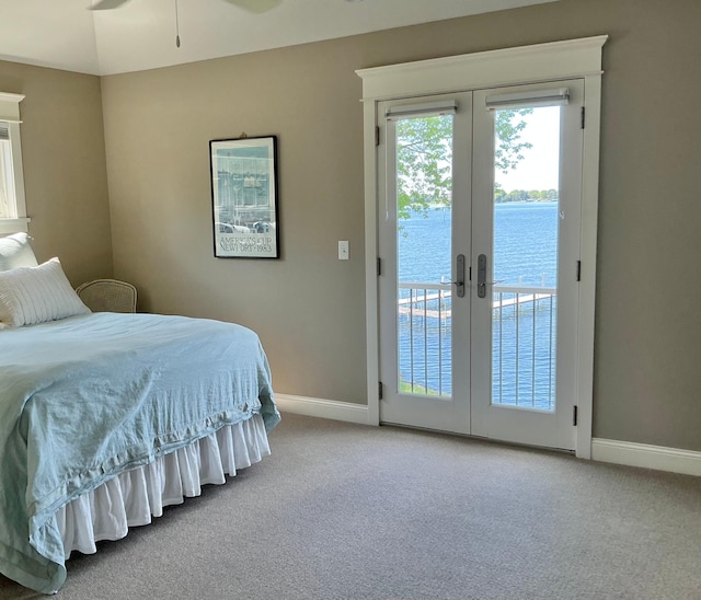 1105 Ferndale Rd W, Orono, MN 55391 - carpeted bedroom featuring access to outside, french doors, and a water view