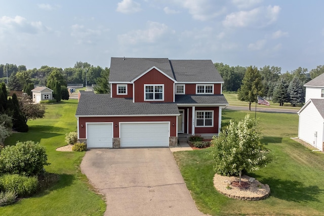 14192 Bayberry Trl, Rosemount, MN 55068 - view of front facade with asphalt driveway, a garage, a front yard, roof with shingles, and stone siding