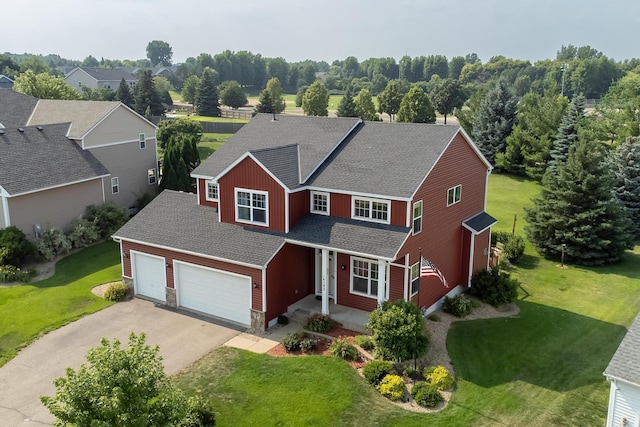 14192 Bayberry Trl, Rosemount, MN 55068 - traditional-style home featuring roof with shingles, driveway, a front yard, a garage, and a porch
