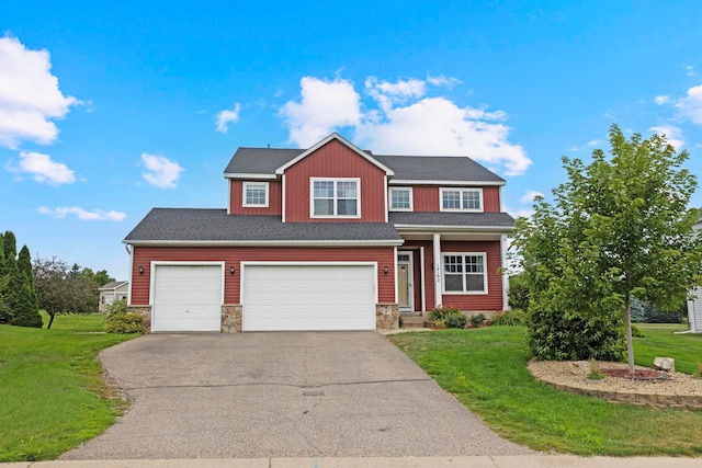 14192 Bayberry Trl, Rosemount, MN 55068 - traditional-style home featuring driveway, stone siding, a front yard, a garage, and roof with shingles