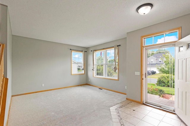 14192 Bayberry Trl, Rosemount, MN 55068 - entryway with a textured ceiling and light colored carpet