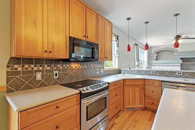 14192 Bayberry Trl, Rosemount, MN 55068 - kitchen featuring stainless steel appliances, light wood-type flooring, hanging light fixtures, ceiling fan, and decorative backsplash