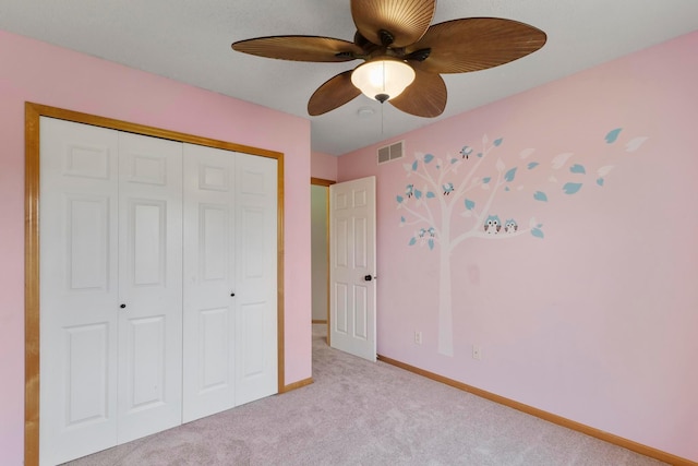 14192 Bayberry Trl, Rosemount, MN 55068 - unfurnished bedroom featuring carpet, a closet, and ceiling fan