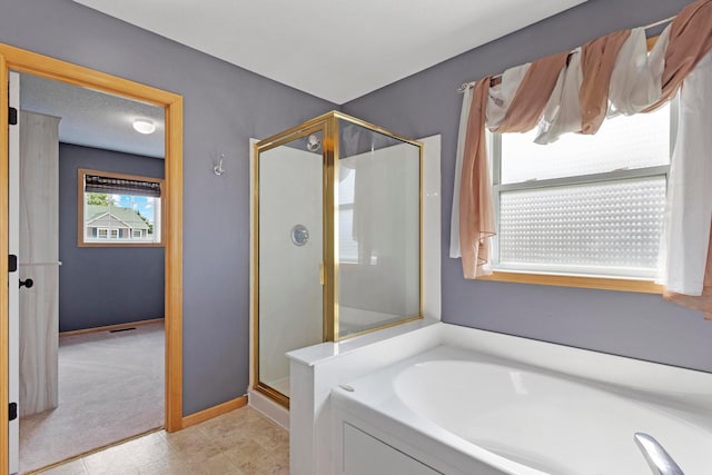 14192 Bayberry Trl, Rosemount, MN 55068 - bathroom featuring a shower stall and a bath