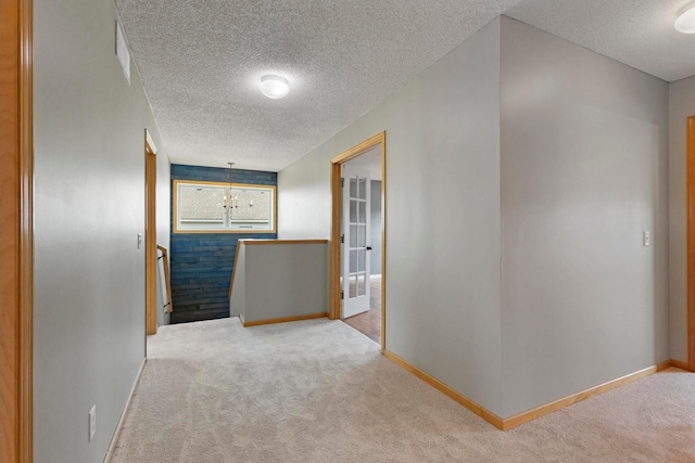 14192 Bayberry Trl, Rosemount, MN 55068 - corridor with an upstairs landing, light colored carpet, and a textured ceiling