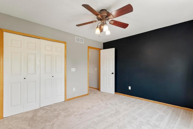 14192 Bayberry Trl, Rosemount, MN 55068 - unfurnished bedroom with carpet, a closet, and a ceiling fan