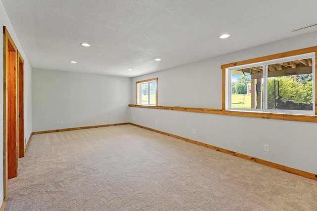 14192 Bayberry Trl, Rosemount, MN 55068 - empty room featuring recessed lighting, light carpet, and a textured ceiling