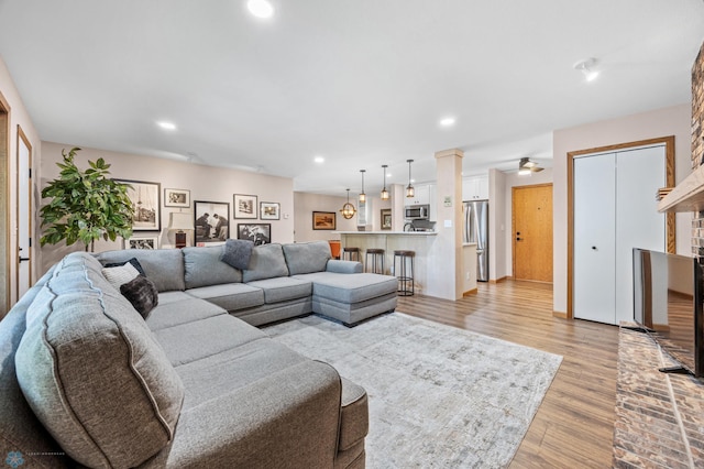 2636 18th St S Unit 8, Fargo, ND 58103 - living area featuring recessed lighting, light wood-type flooring, a brick fireplace, and a ceiling fan