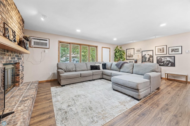 2636 18th St S Unit 8, Fargo, ND 58103 - living room with a brick fireplace, dark wood-style floors, a wall unit AC, and recessed lighting