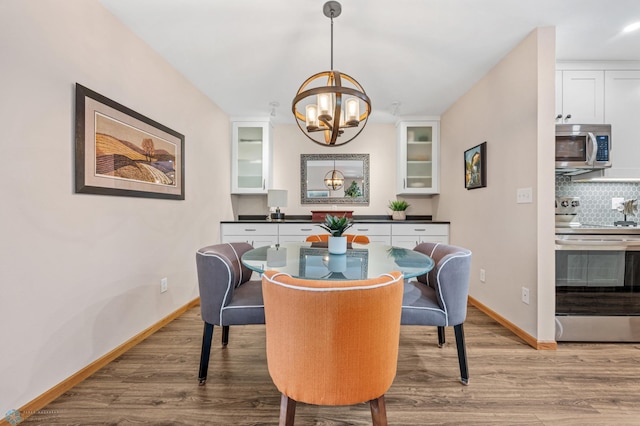 2636 18th St S Unit 8, Fargo, ND 58103 - dining area with wood finished floors and a chandelier