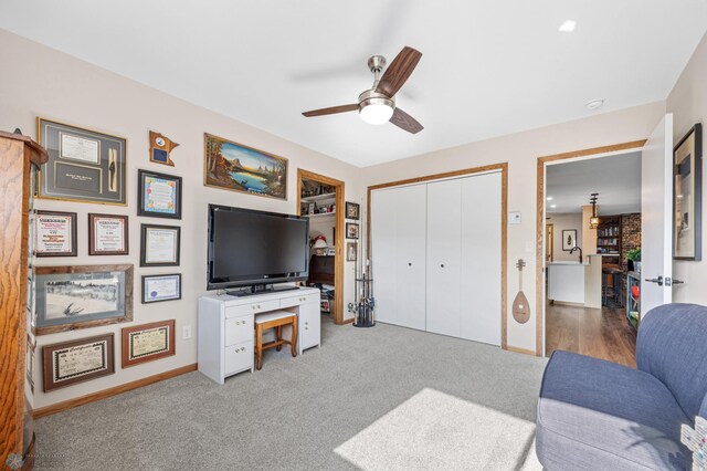 2636 18th St S Unit 8, Fargo, ND 58103 - carpeted living area with ceiling fan and baseboards