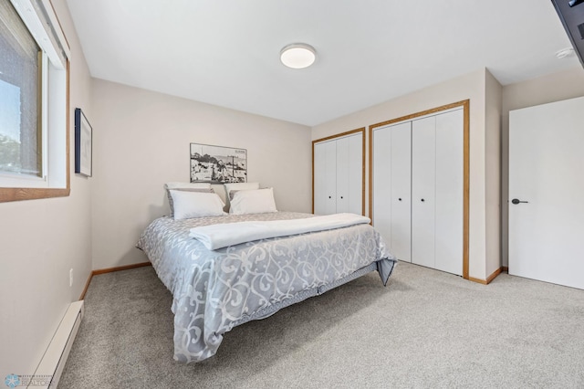 2636 18th St S Unit 8, Fargo, ND 58103 - carpeted bedroom featuring a baseboard radiator and two closets