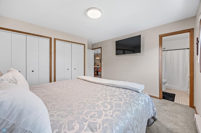 2636 18th St S Unit 8, Fargo, ND 58103 - bedroom with multiple closets, carpet, and connected bathroom