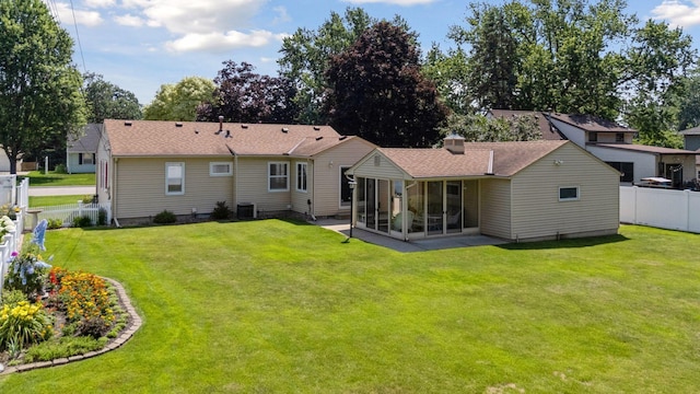 8300 Sheridan Ave S, Bloomington, MN 55431 - rear view of property with a sunroom and a fenced backyard