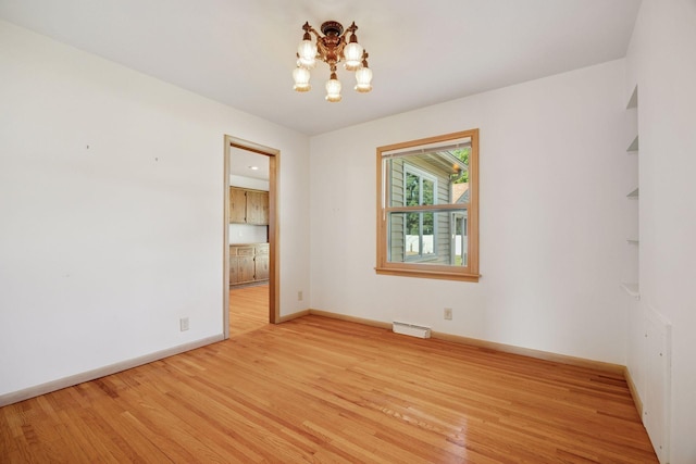 8300 Sheridan Ave S, Bloomington, MN 55431 - empty room featuring wood finished floors and a chandelier