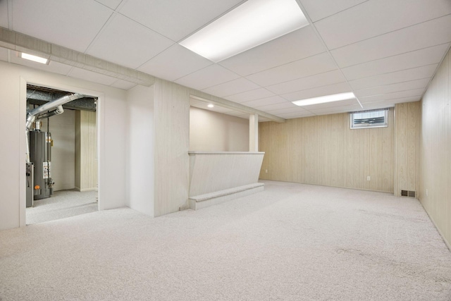 8300 Sheridan Ave S, Bloomington, MN 55431 - below grade area with water heater, carpet floors, wooden walls, and a paneled ceiling
