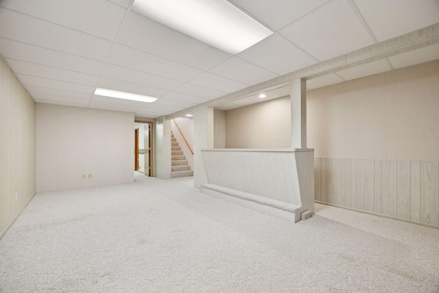 8300 Sheridan Ave S, Bloomington, MN 55431 - finished below grade area with carpet flooring, stairway, a drop ceiling, and wooden walls