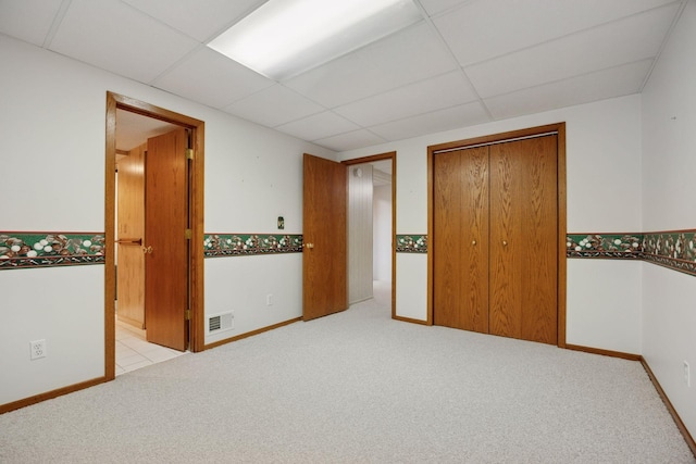 8300 Sheridan Ave S, Bloomington, MN 55431 - unfurnished bedroom featuring a paneled ceiling, carpet flooring, a closet, and connected bathroom