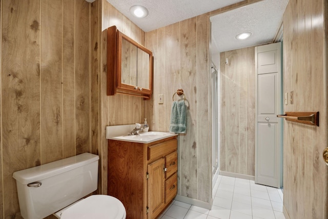 8300 Sheridan Ave S, Bloomington, MN 55431 - full bath with a textured ceiling, vanity, a shower stall, tile patterned flooring, and wooden walls