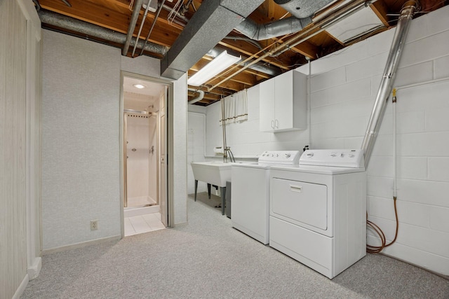 8300 Sheridan Ave S, Bloomington, MN 55431 - washroom with cabinet space, washing machine and dryer, and light colored carpet