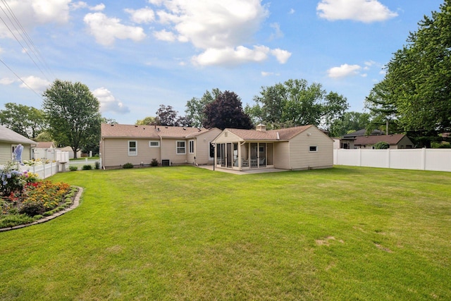 8300 Sheridan Ave S, Bloomington, MN 55431 - rear view of house with a sunroom, a fenced backyard, a patio area, and a chimney