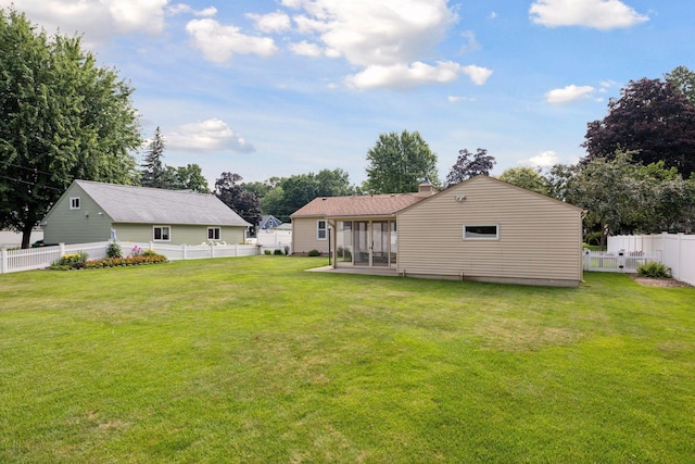 8300 Sheridan Ave S, Bloomington, MN 55431 - back of house featuring a fenced backyard, a chimney, and a sunroom