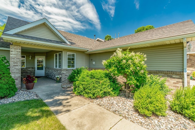 10 Cree Point Dr, Mankato, MN 56001 - doorway to property with brick siding and roof with shingles