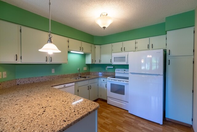 10 Cree Point Dr, Mankato, MN 56001 - kitchen featuring white appliances, decorative light fixtures, light wood-style floors, a textured ceiling, and light stone counters