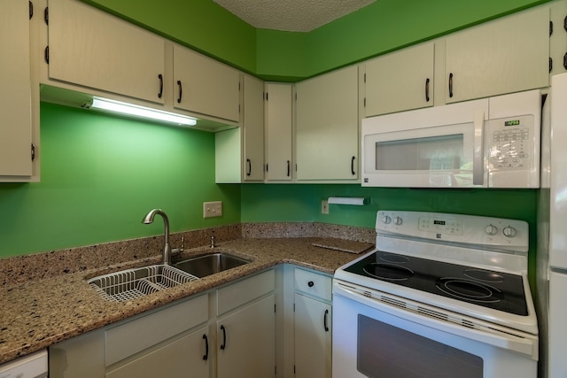 10 Cree Point Dr, Mankato, MN 56001 - kitchen with white appliances, light stone countertops, and a textured ceiling
