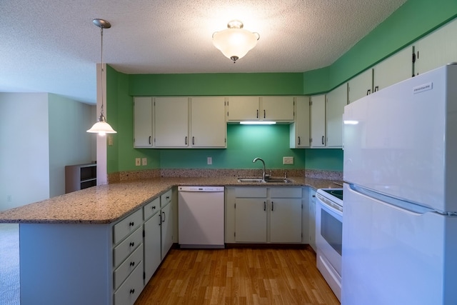 10 Cree Point Dr, Mankato, MN 56001 - kitchen with white appliances, a peninsula, light wood-type flooring, a textured ceiling, and white cabinets
