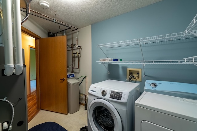 10 Cree Point Dr, Mankato, MN 56001 - washroom with washer and clothes dryer and a textured ceiling