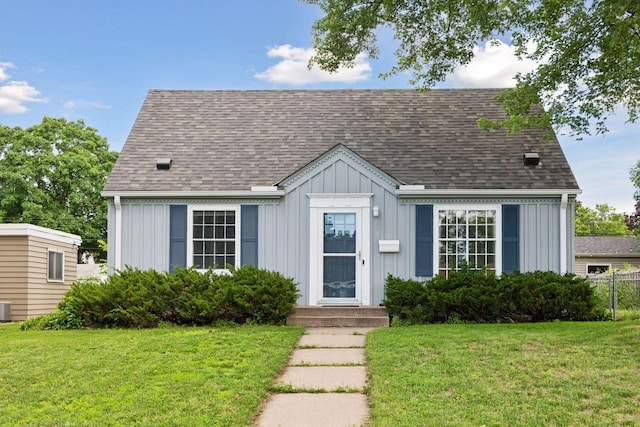 5917 Oliver Ave S, Minneapolis, MN 55419 - view of front of house featuring board and batten siding, a front lawn, and a shingled roof