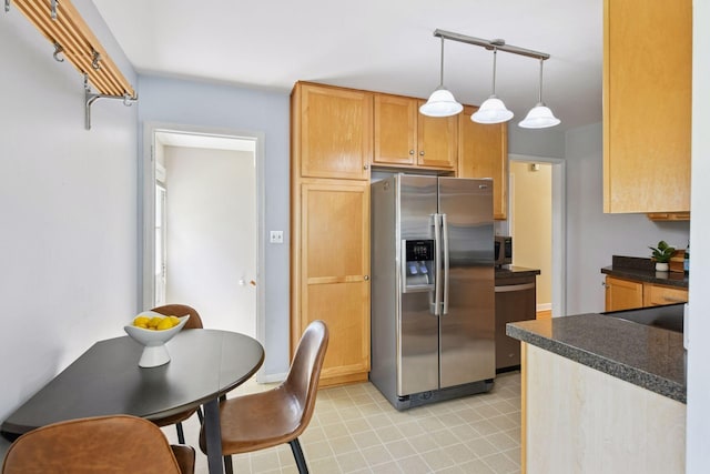 5917 Oliver Ave S, Minneapolis, MN 55419 - kitchen with appliances with stainless steel finishes, dark countertops, and hanging light fixtures
